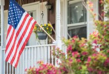 A closeup of the U.S. flag on a single-family home